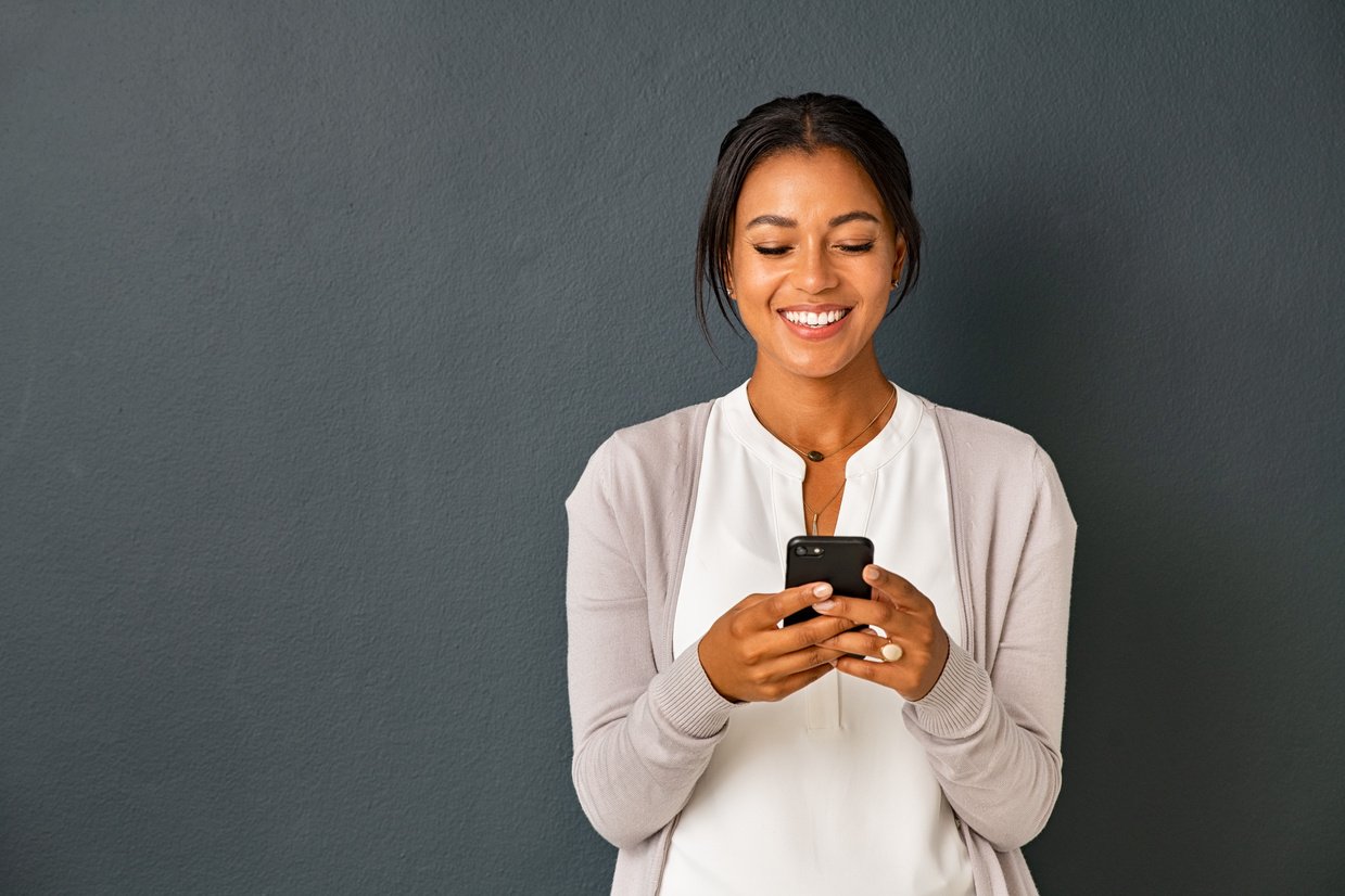 Happy Woman Using Smartphone